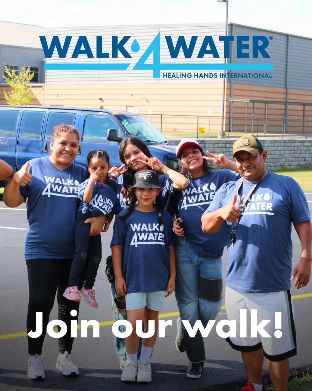 Walk4Water participants carrying water together